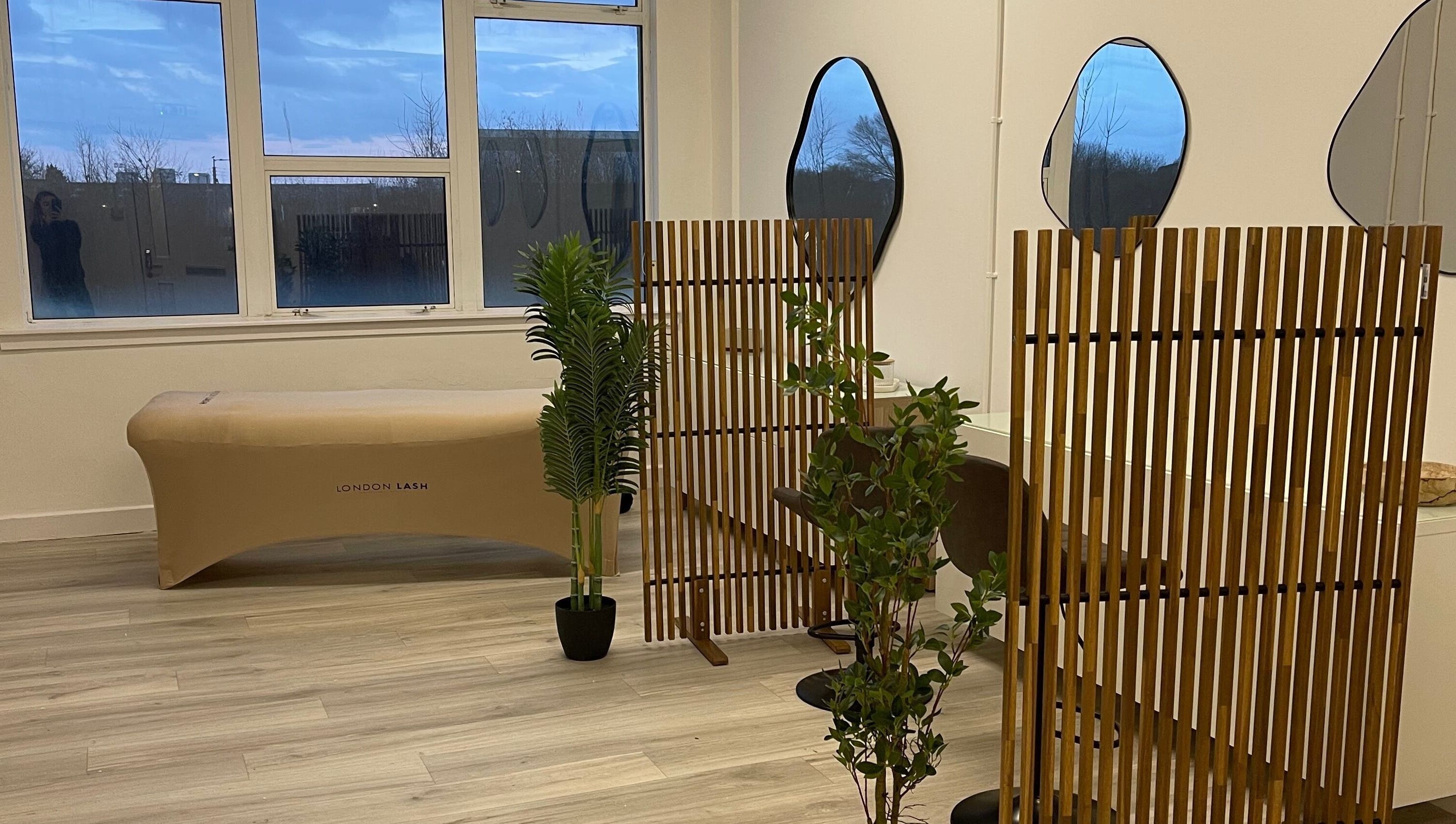 Elegant beauty space with mirrors and wooden decor at Twenty2 Cosmetics, Clydebank, Scotland, GB.