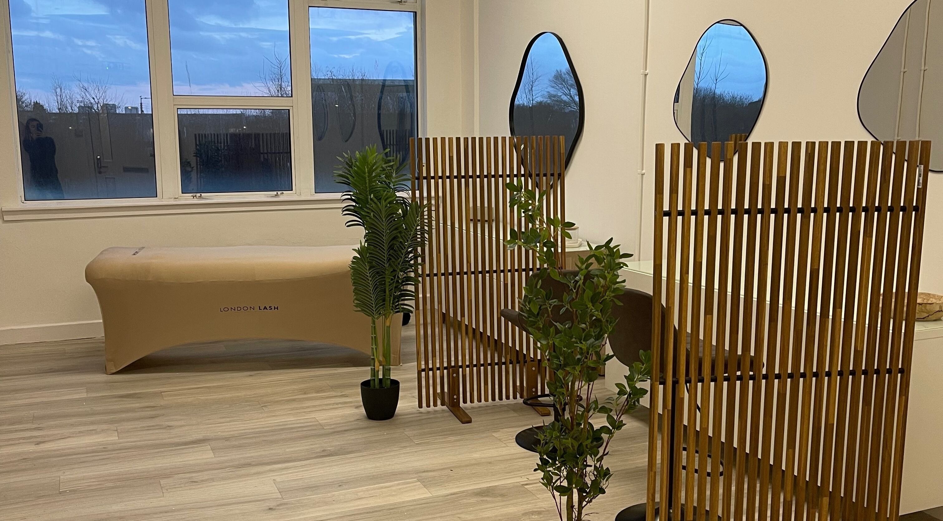 Elegant beauty space with mirrors and wooden decor at Twenty2 Cosmetics, Clydebank, Scotland, GB.