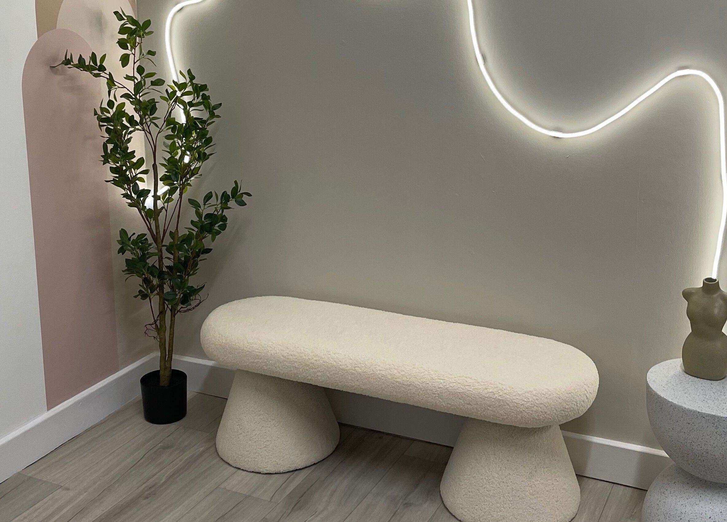 Elegant seating area with soft lighting at Twenty2 Cosmetics, Clydebank, Scotland, GB. Modern and inviting design.
