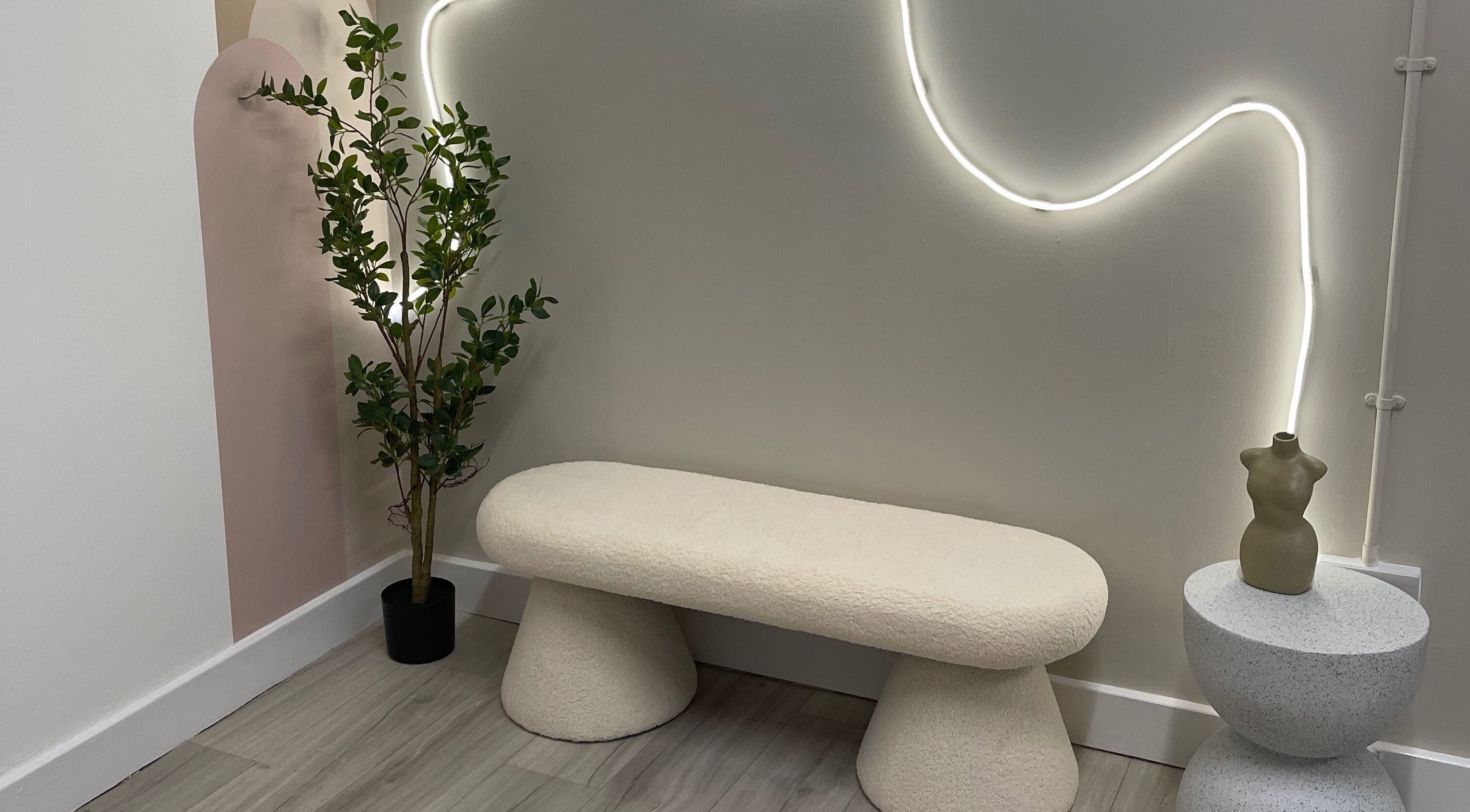 Elegant seating area with soft lighting at Twenty2 Cosmetics, Clydebank, Scotland, GB. Modern and inviting design.