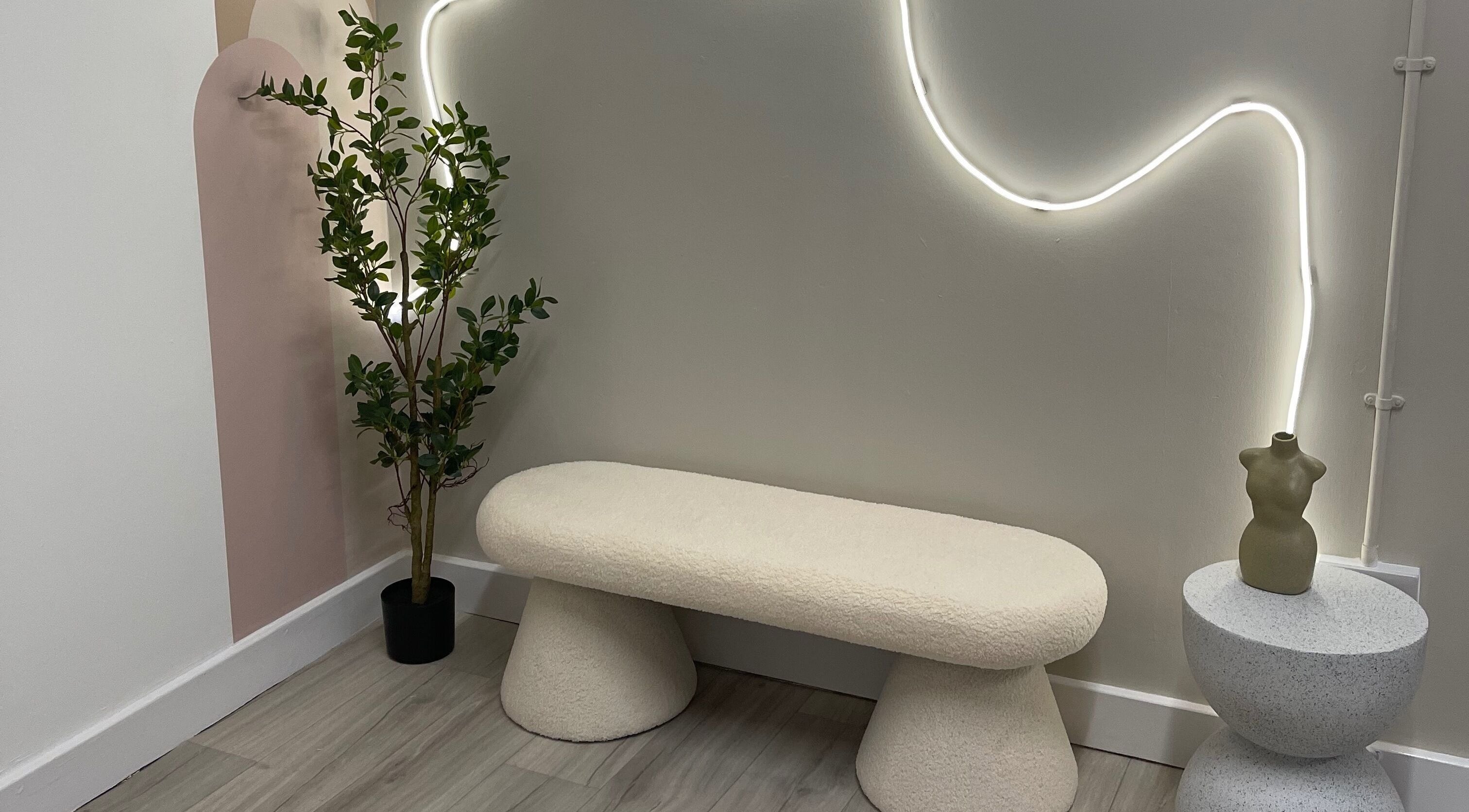 Elegant seating area with soft lighting at Twenty2 Cosmetics, Clydebank, Scotland, GB. Modern and inviting design.