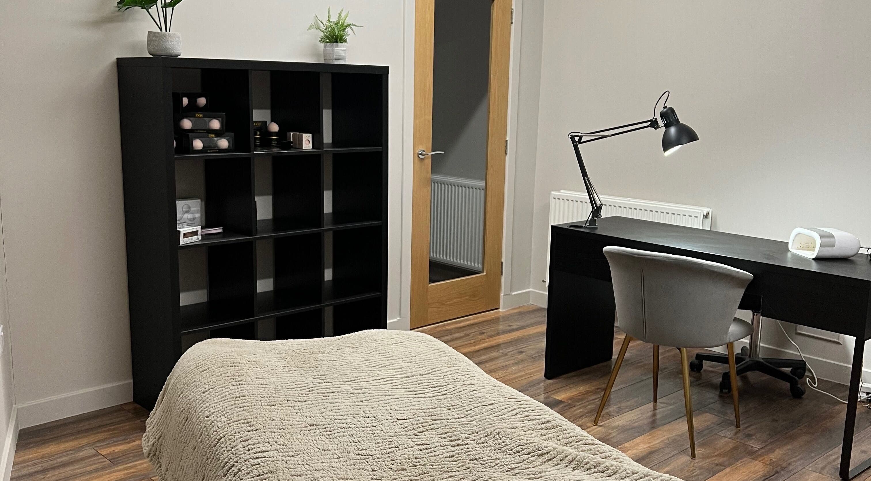 Relaxing treatment room at Donna's Beauty Room in Thurso, Scotland, GB with a desk and cozy ambiance.