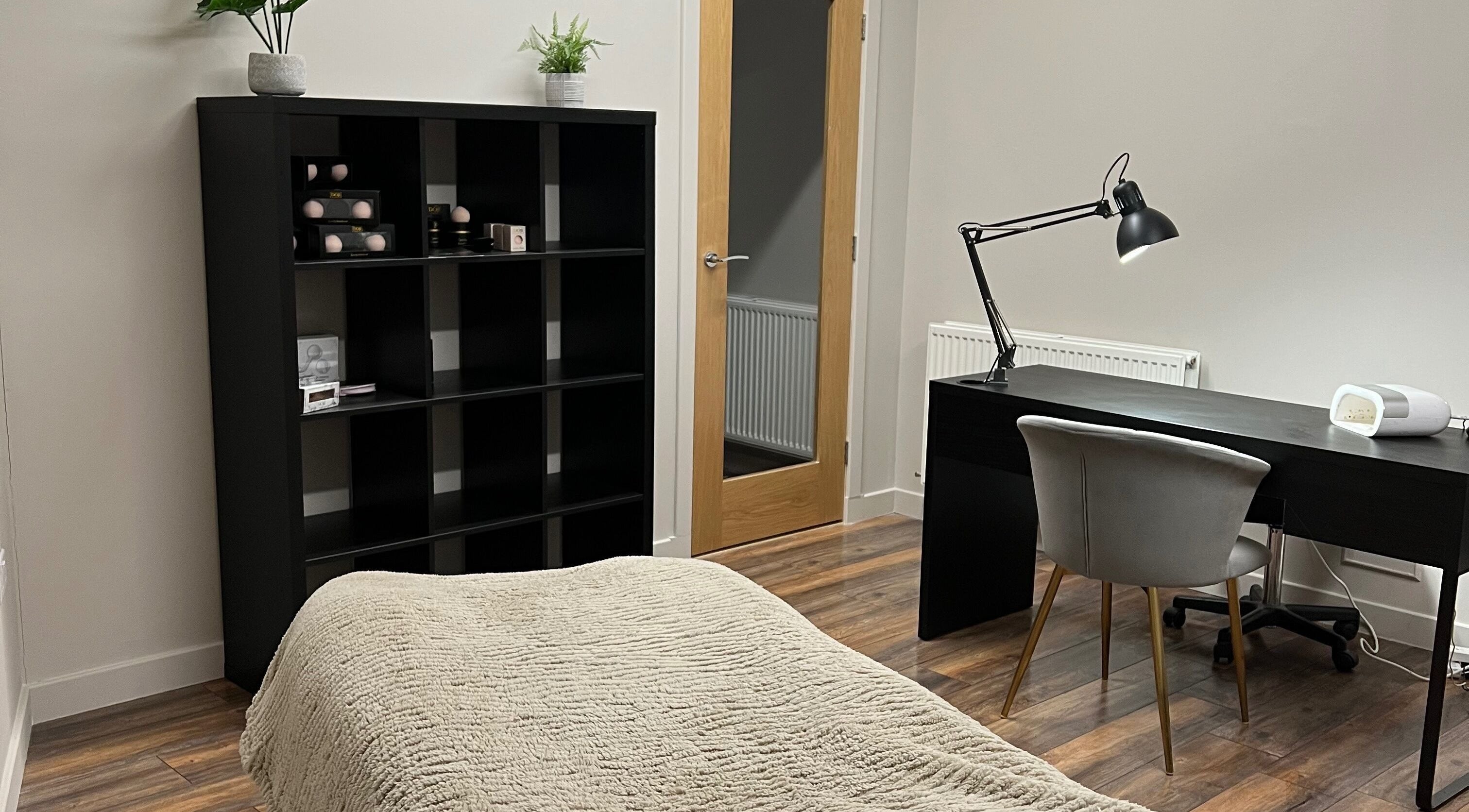 Relaxing treatment room at Donna's Beauty Room in Thurso, Scotland, GB with a desk and cozy ambiance.