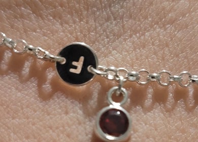 Close-up of a silver chain bracelet at Anubis Piercings and Laser Tattoo Removal, Ashby-de-la-zouch, England, GB.