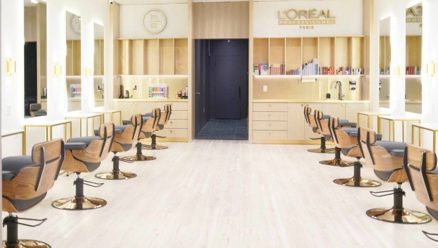 Modern salon interior at House of Colour, Richmond, BC, CA, with sleek chairs and mirrors.