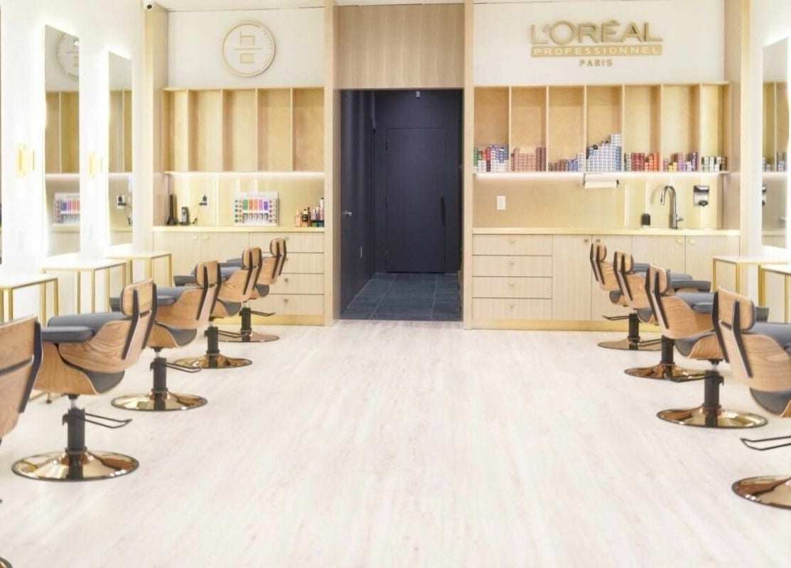 Modern salon interior at House of Colour, Richmond, BC, CA, with sleek chairs and mirrors.