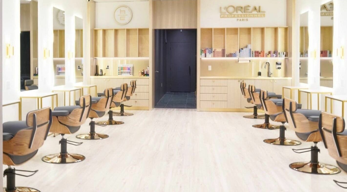 Modern salon interior at House of Colour, Richmond, BC, CA, with sleek chairs and mirrors.