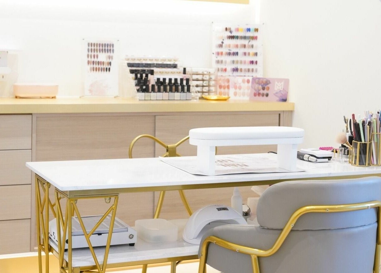 Luxurious nail station at House of Colour, Richmond, British Columbia, CA with elegant gold accents and organized tools.