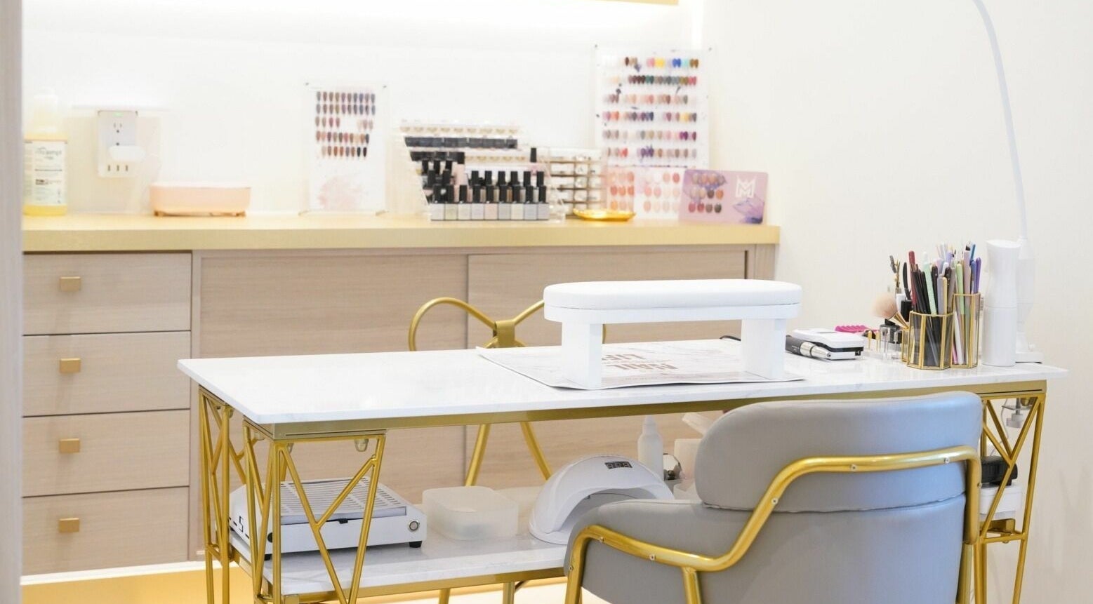 Luxurious nail station at House of Colour, Richmond, British Columbia, CA with elegant gold accents and organized tools.