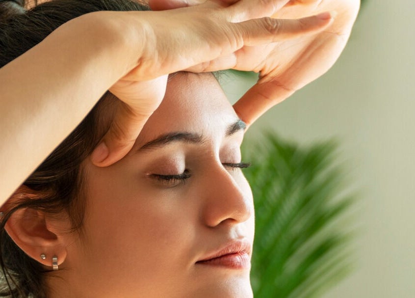 Reiki session at Land of Reiki and Aroma by Sol, Sutton-in-Ashfield, England, GB. Person calmly receiving energy healing.