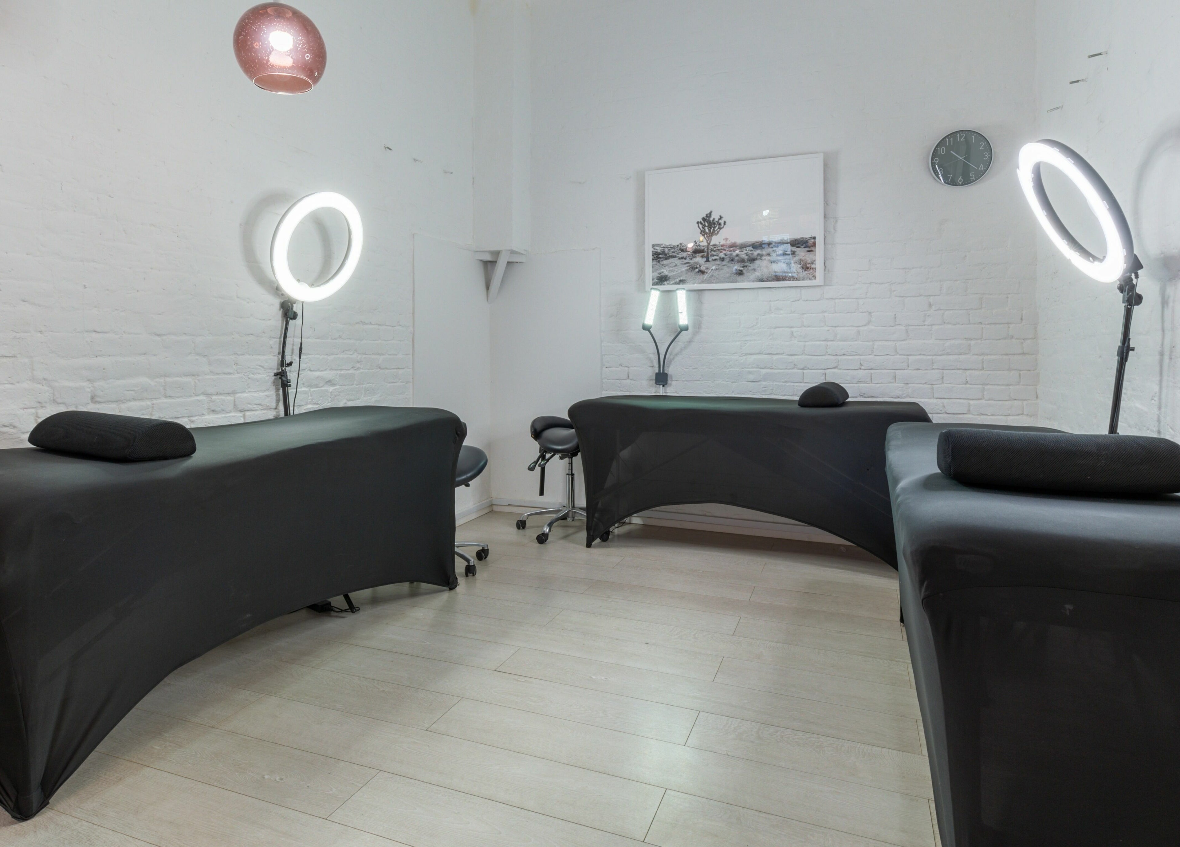 Interior of Jiemao Lashes & Brows Shoreditch in London, England, GB, featuring modern treatment beds and decor.