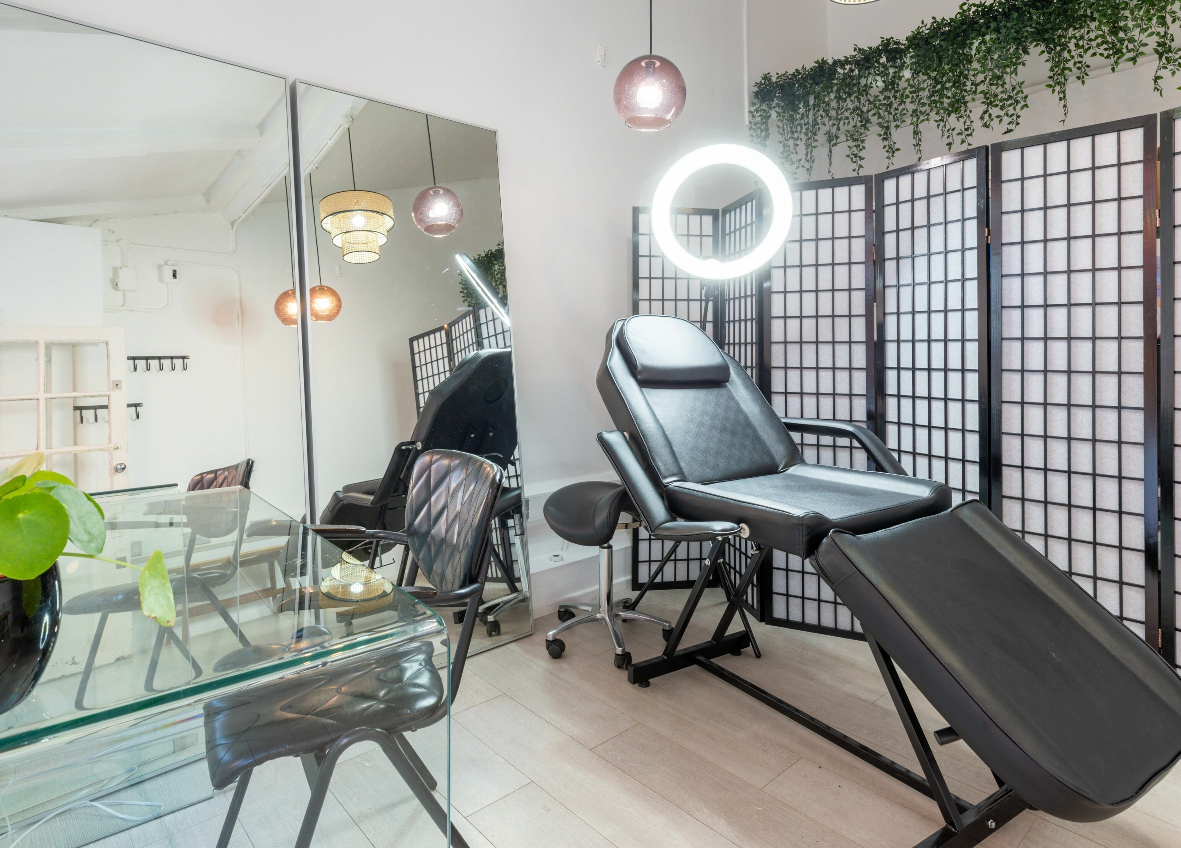 Modern treatment room at Jiemao Lashes & Brows Shoreditch, London, England, GB featuring a chic reclining chair.