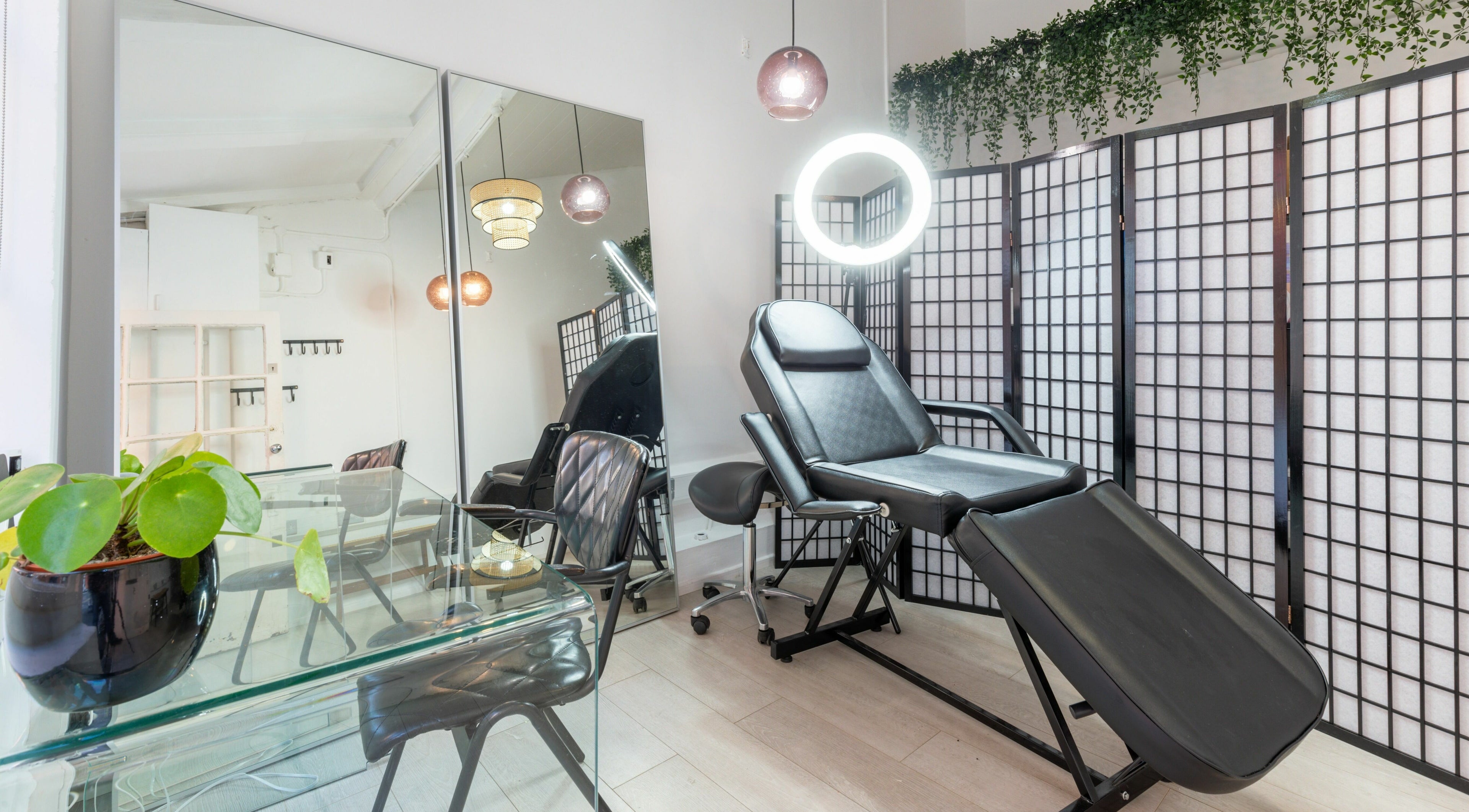 Modern treatment room at Jiemao Lashes & Brows Shoreditch, London, England, GB featuring a chic reclining chair.