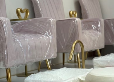 Elegant nail salon chairs at R. Luxury Nails & Beauty in St. Catharines, Ontario, CA offering premium comfort.