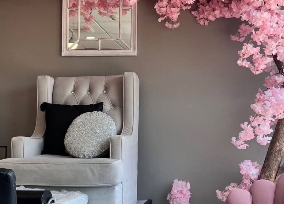 Luxurious lounge at Hamilton / R. Luxury Nails & Beauty, Hamilton, Ontario, CA with cherry blossom decor.