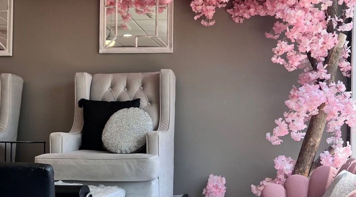 Luxurious lounge at Hamilton / R. Luxury Nails & Beauty, Hamilton, Ontario, CA with cherry blossom decor.