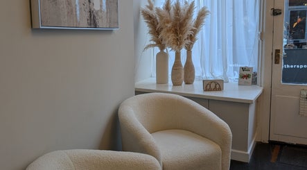 Relaxing corner at Tonic Beauty Therapies, Chepstow, Wales, GB, featuring stylish chairs and elegant decor.