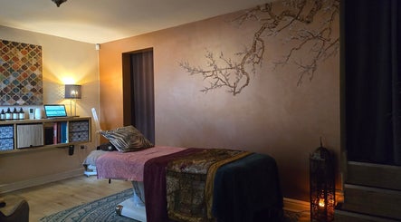 Tranquil massage room at The Treatment Rooms, Dudley, England, GB, with calming decor and ambient lighting.