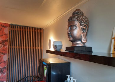 Buddha statue in tranquil room at 美足 Michi Massage, Christchurch, Canterbury, NZ.