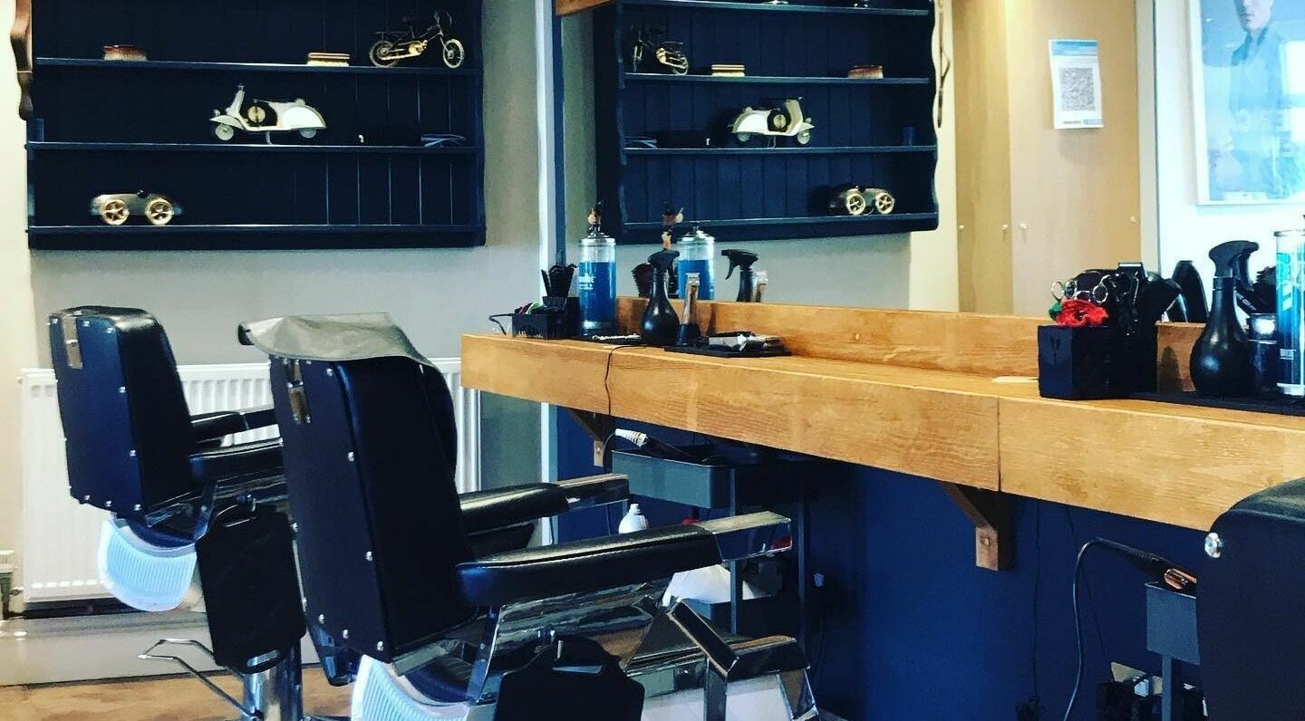 Elegant interior of Clippers for Men in Southam, England, GB featuring classic barber chairs and vintage decor.