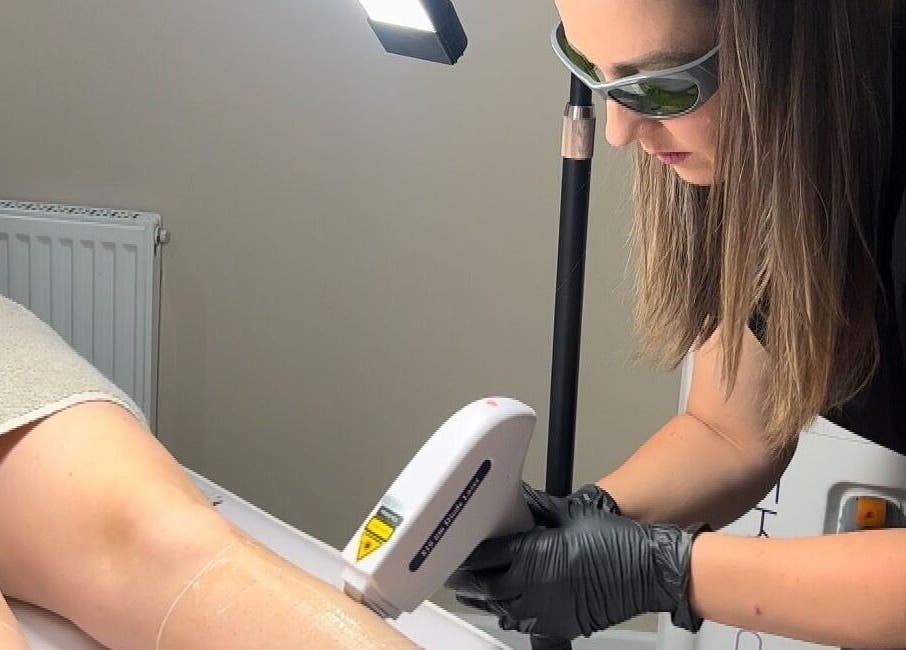 Technician performs laser treatment at Revitalize Beauty and Aesthetics, Westgate-on-Sea, England, GB.