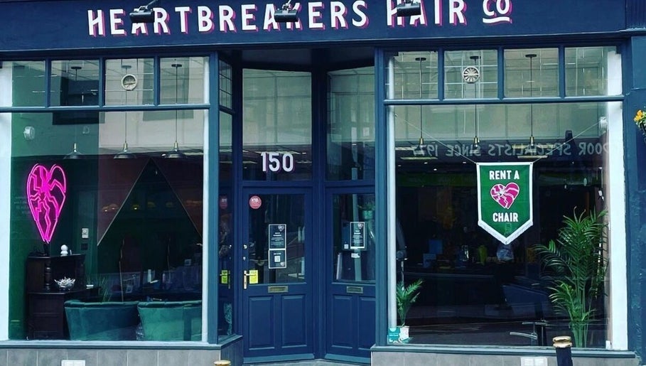 Main entrance of Lauren Wingfield at Heartbreakers, Exeter, England, GB with neon heart sign.