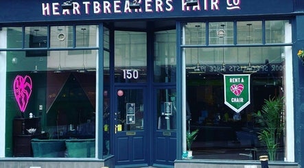 Main entrance of Lauren Wingfield at Heartbreakers, Exeter, England, GB with neon heart sign.
