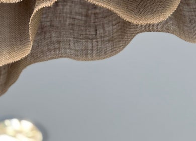 Elegant linen drapes at Evergreen Salon Durham Road, Gateshead, England, GB, adding warmth to the ambiance.