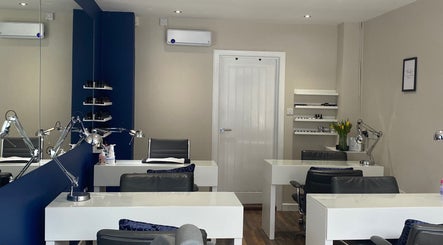 Modern interior of Lauren Jeffrey Nails in East Calder, Scotland, GB showcasing sleek nail stations.