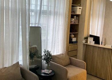 Bright and cozy reception at Nails & Co., Lekki, Lagos, NG with comfortable seating and elegant decor.