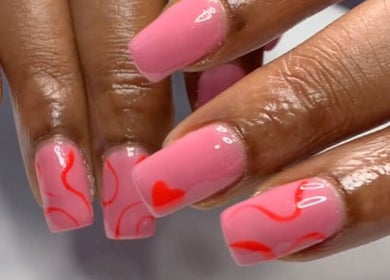 Stylish pink and red nail design at Nails & Co., Lekki, Lagos, NG showcasing elegance and flair.