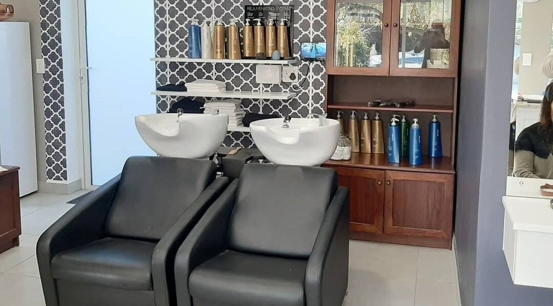 Modern wash station at Sherri Styles at 134 Upper Orange, Somerset West, Western Cape, ZA with stylish decor.