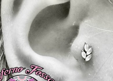 Detailed view of a stylish ear piercing at Inferno Fossa in Douglas, Middle, GB.