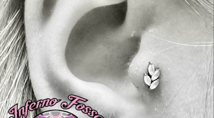 Detailed view of a stylish ear piercing at Inferno Fossa in Douglas, Middle, GB.