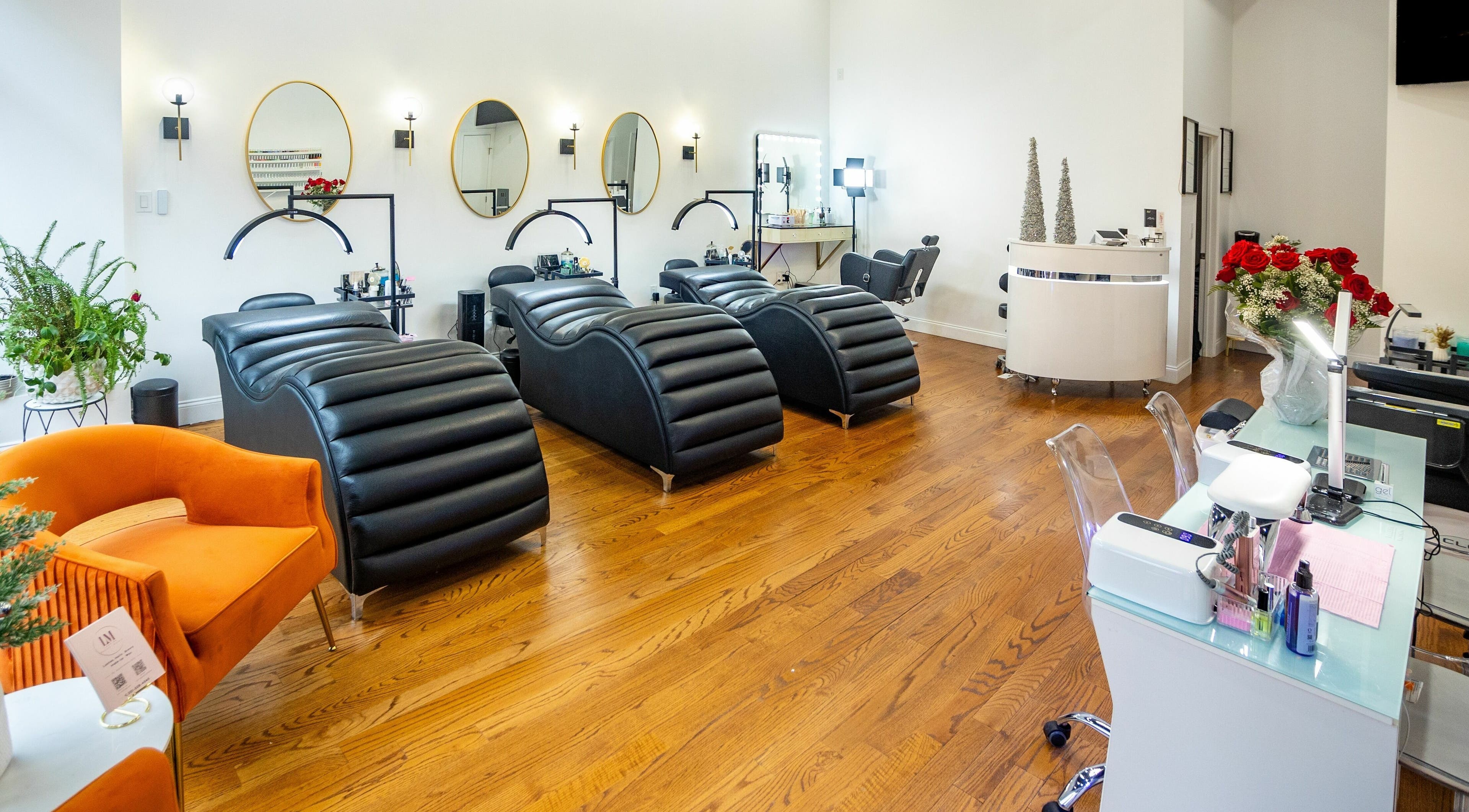 Stylish treatment area at Lash Me Beauty Studio, Union City, New Jersey, US, with modern reclining chairs.