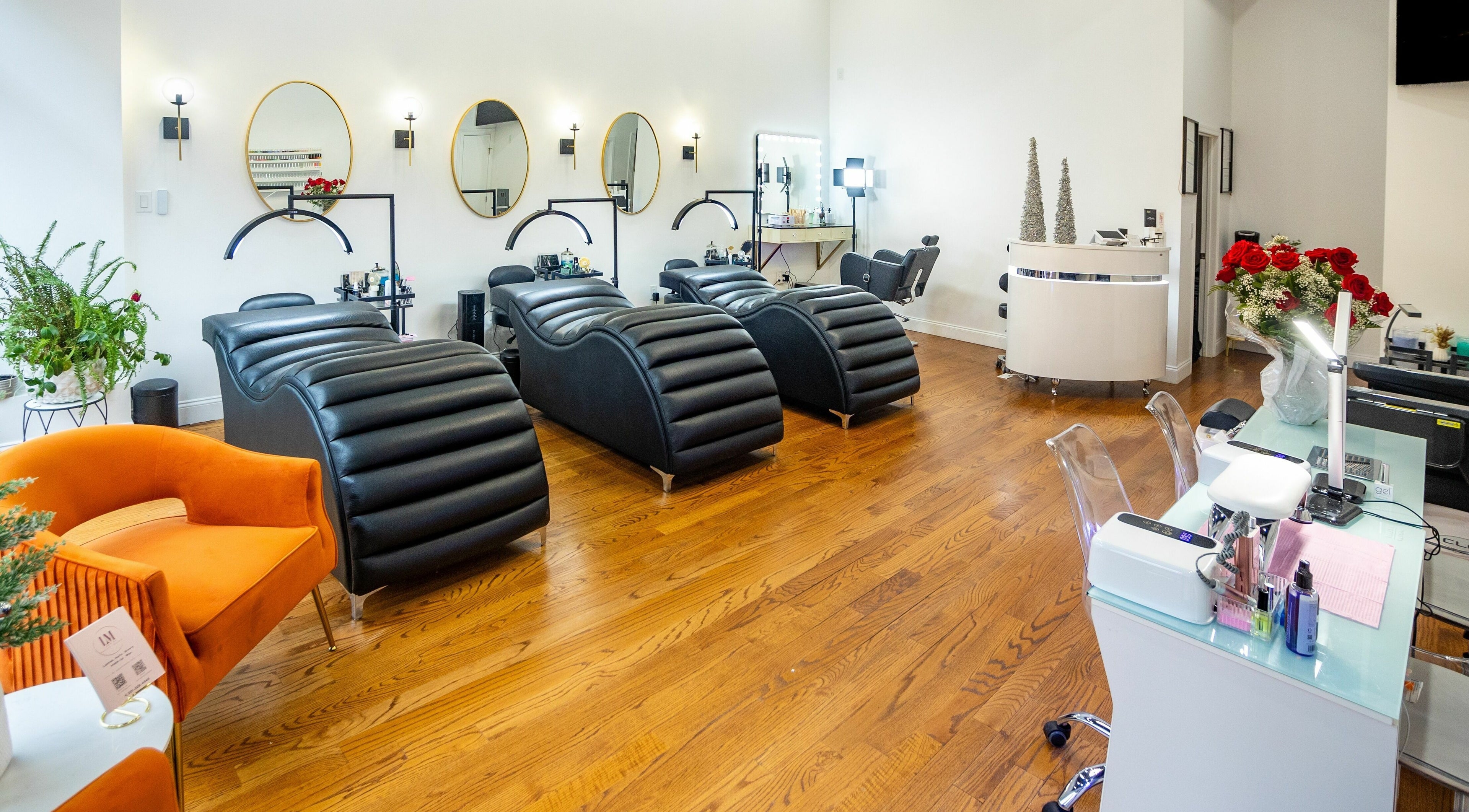 Stylish treatment area at Lash Me Beauty Studio, Union City, New Jersey, US, with modern reclining chairs.