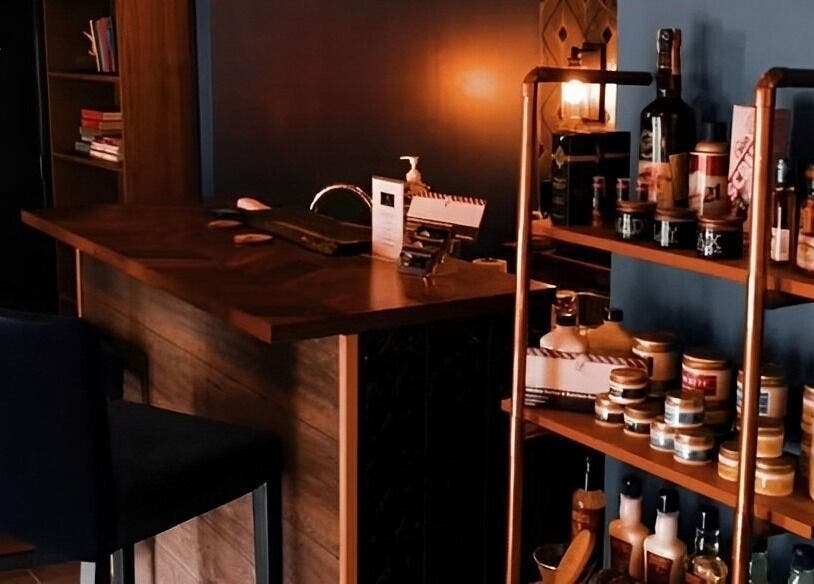 Warm, inviting interior of Prohibition Barber & Bourbon Room, Canmore, Alberta, CA, showcasing products and seating.