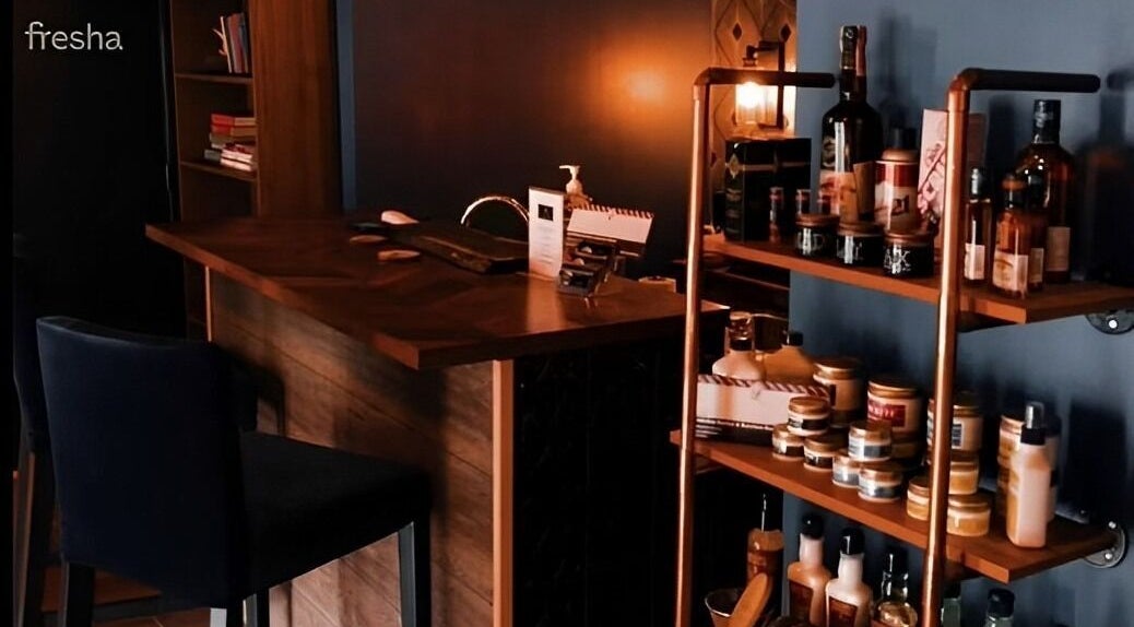 Warm, inviting interior of Prohibition Barber & Bourbon Room, Canmore, Alberta, CA, showcasing products and seating.