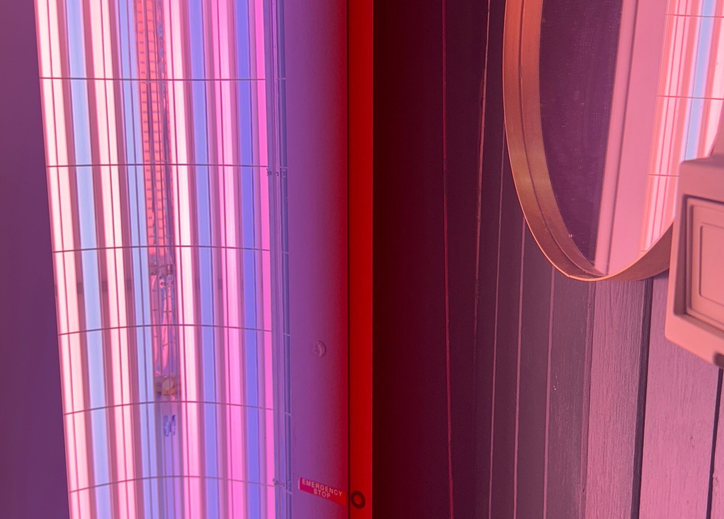 Neon tanning bed at Glo Tanning & Beauty Salon Newtown, Newtown, Wales, GB offering a stylish aesthetic.