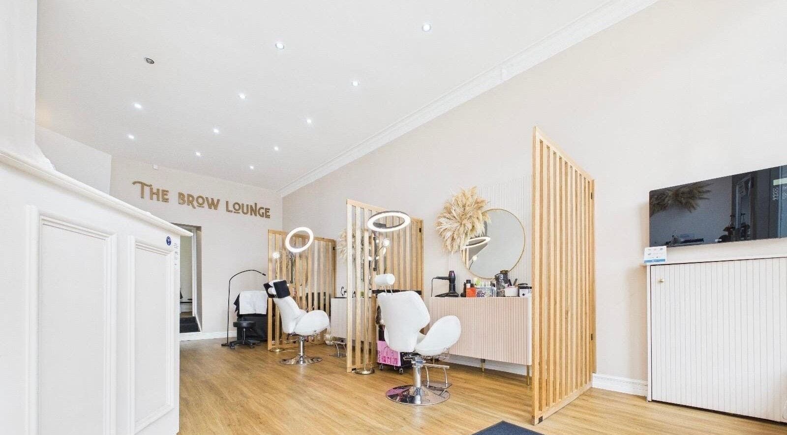 Elegant interior of The Brow Lounge Aesthetics and Beauty in Bishop Auckland, England, showcasing modern styling chairs.