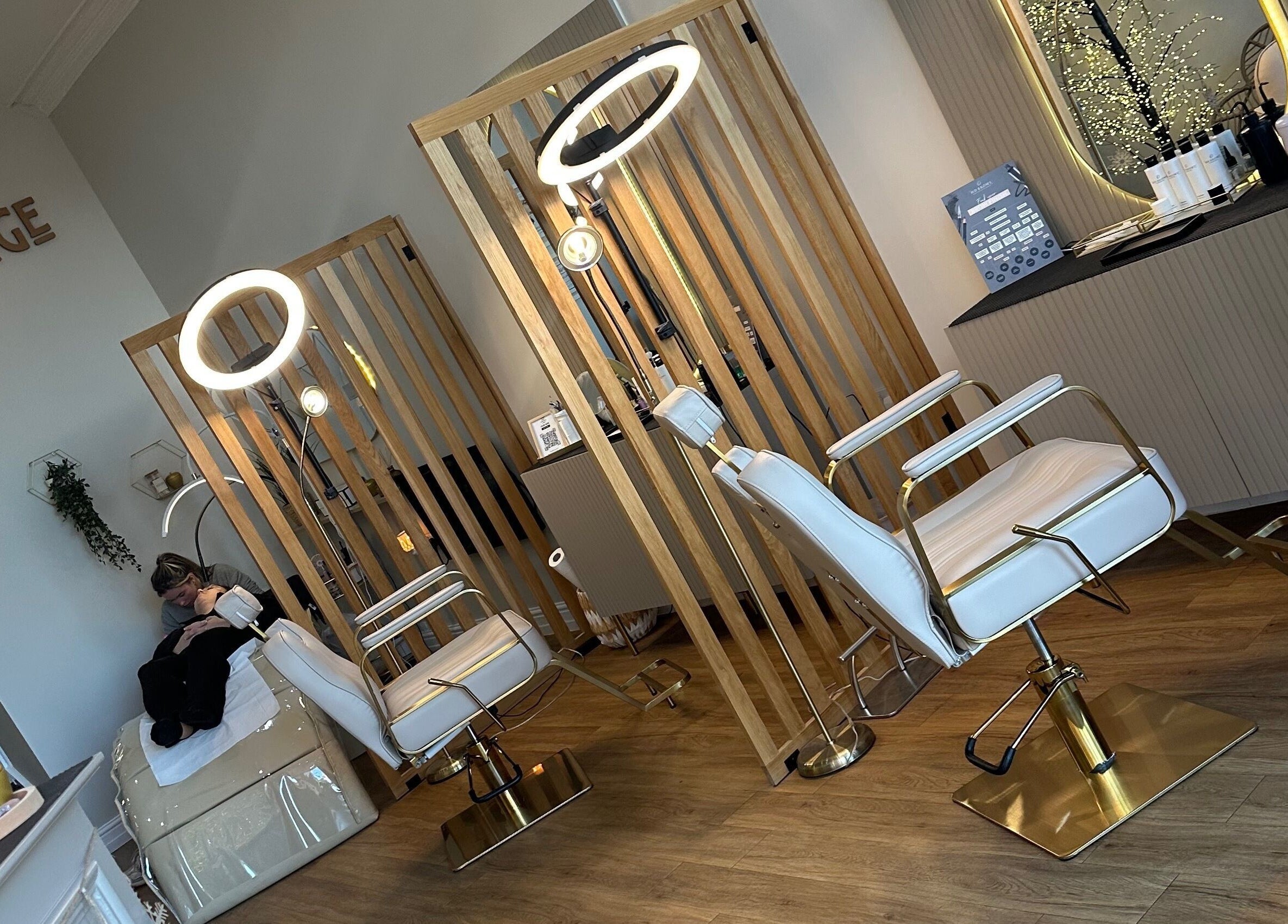 Chic interior of The Brow Lounge Aesthetics and Beauty, Bishop Auckland, England, GB, with modern styling chairs.