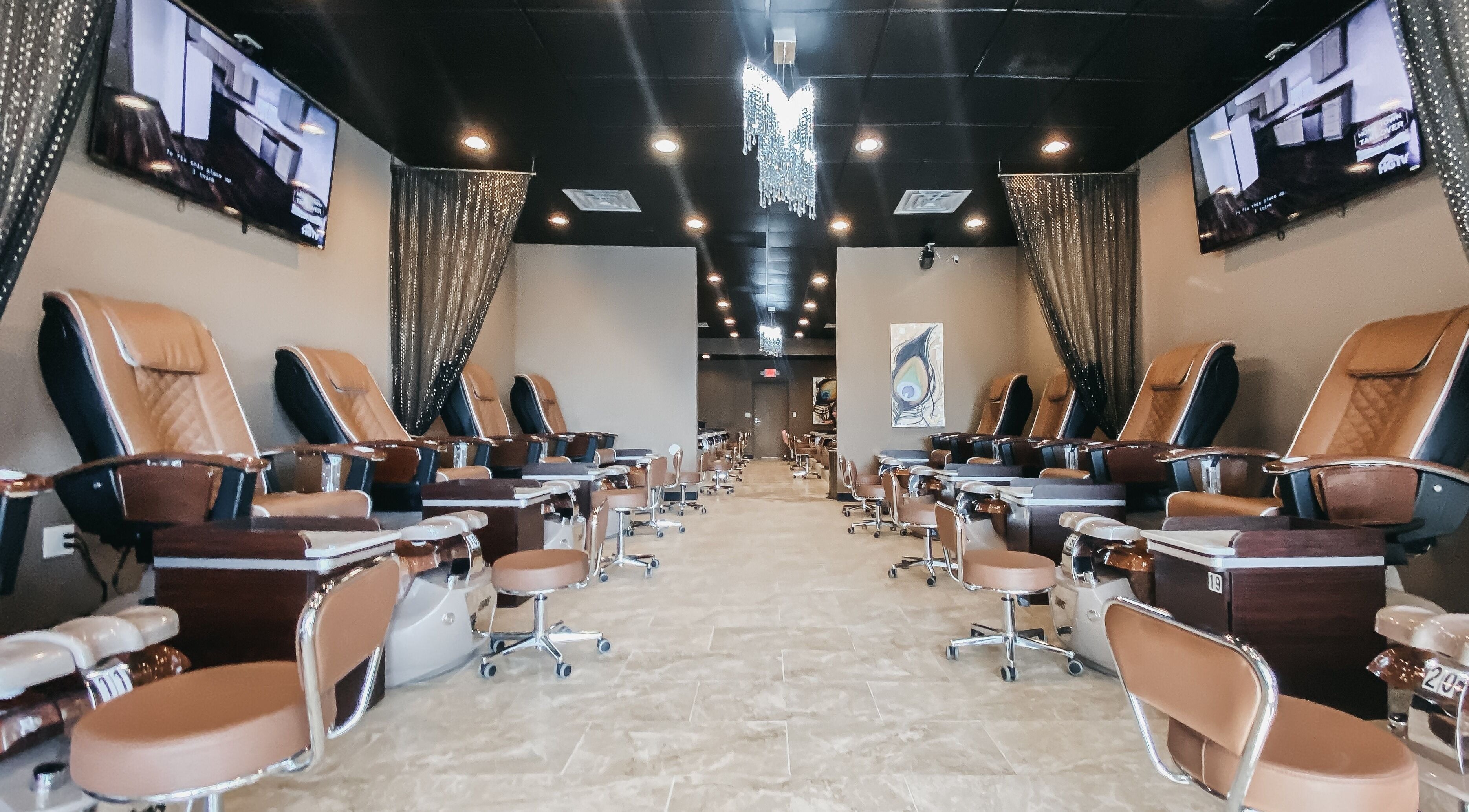 Luxurious pedicure chairs at The Golden File, Georgetown Township, Michigan, US. Modern spa setting.
