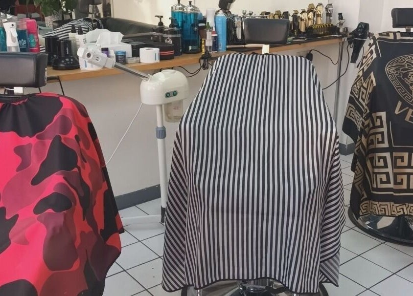 Stylish barber chairs at The Trimmers Wood Green in London, England, GB offer premium grooming experience.