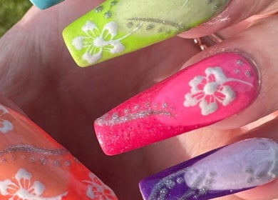 Colorful floral nail art from Kelly's Klaws in Barrow-in-Furness, England, GB, showcasing creative designs.