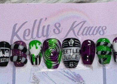 Unique Beetlejuice-themed nail art at Kelly's Klaws in Barrow-in-Furness, England, GB, showcasing vibrant designs.
