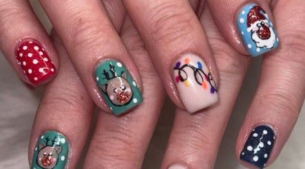 Festive nail art at Kelly's Klaws, Barrow-in-Furness, England, GB showcases holiday-themed designs.