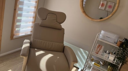 Relaxing treatment chair at Charlotte Burris Beauty in Caerphilly, Wales, GB, showcasing serene ambiance.