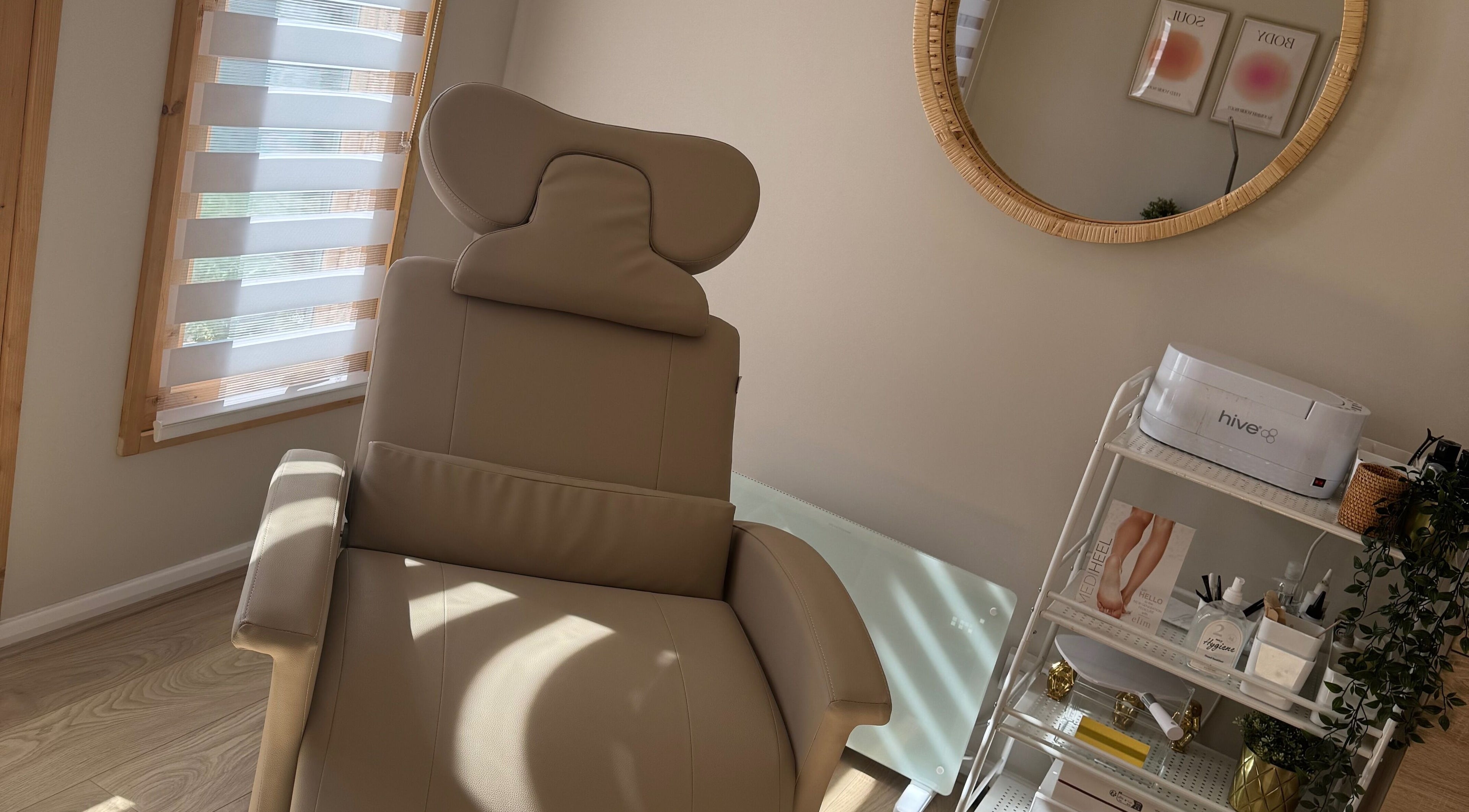 Relaxing treatment chair at Charlotte Burris Beauty in Caerphilly, Wales, GB, showcasing serene ambiance.