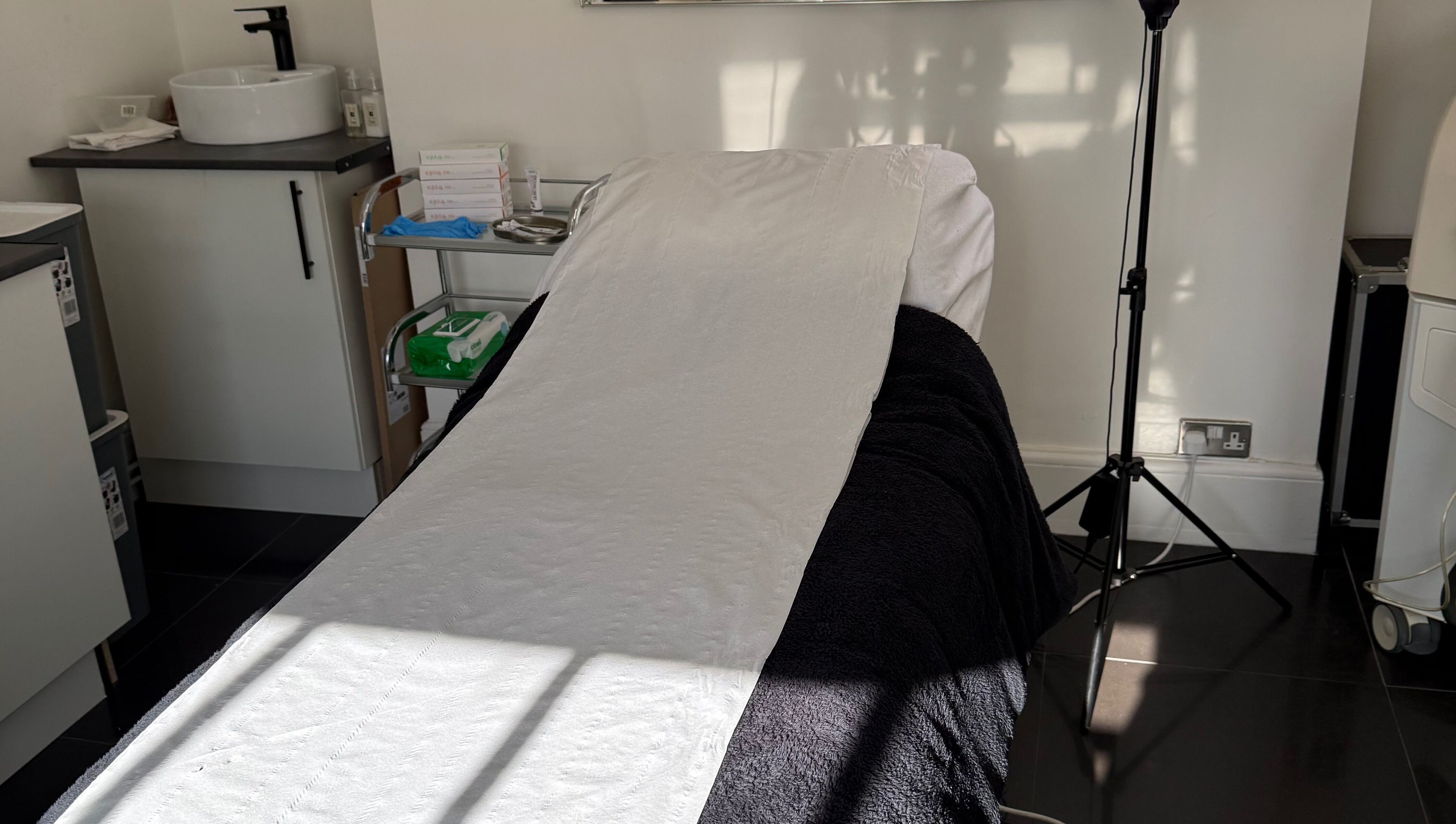 Treatment bed at MBA Aesthetics & Training in Southampton, England, GB, offering a serene wellness experience.