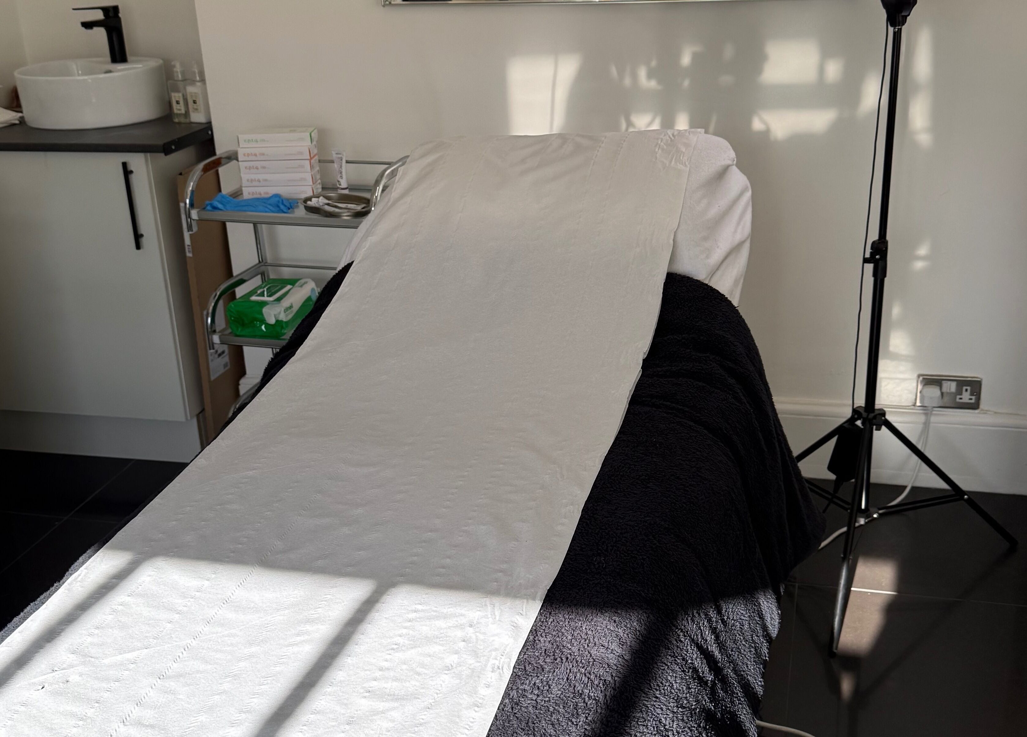 Treatment bed at MBA Aesthetics & Training in Southampton, England, GB, offering a serene wellness experience.